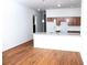 Modern kitchen with island and hardwood floors at 575 Rockwell Sw St, Atlanta, GA 30310