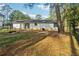 Home's backyard with wooded area and patio at 9012 Hurst Ct, Jonesboro, GA 30238