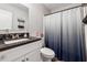 Clean bathroom with white vanity and dark countertop at 9012 Hurst Ct, Jonesboro, GA 30238