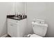Small bathroom with white vanity and granite countertop at 9012 Hurst Ct, Jonesboro, GA 30238
