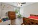 bedroom with two beds, dresser, and alphabet wall art at 9012 Hurst Ct, Jonesboro, GA 30238
