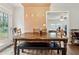 Simple dining area with wooden table and bench at 9012 Hurst Ct, Jonesboro, GA 30238