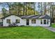 Charming ranch home with freshly painted exterior and manicured lawn at 9012 Hurst Ct, Jonesboro, GA 30238