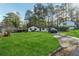 Ranch home with spacious yard and driveway, located in a wooded area at 9012 Hurst Ct, Jonesboro, GA 30238