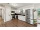 Modern kitchen features stainless steel appliances and dark countertops at 9012 Hurst Ct, Jonesboro, GA 30238