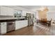 Modern kitchen with white cabinets, stainless steel appliances, and granite countertops at 9012 Hurst Ct, Jonesboro, GA 30238