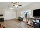 Home office with hardwood floors, ceiling fan, and large windows at 9012 Hurst Ct, Jonesboro, GA 30238