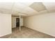 A finished basement area with carpeted flooring and a single support beam at 380 Oak Landing Cir, Douglasville, GA 30134