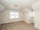 Bedroom with neutral color scheme, carpeted flooring, and windows providing natural light at 380 Oak Landing Cir, Douglasville, GA 30134