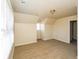 A bedroom with neutral walls and carpet, a dormer window, and a door to another room at 380 Oak Landing Cir, Douglasville, GA 30134
