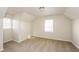 Bedroom with neutral color scheme, carpeted flooring, and windows providing natural light at 380 Oak Landing Cir, Douglasville, GA 30134