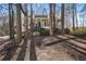 Charming home with a front porch surrounded by trees creating a tranquil, natural setting at 380 Oak Landing Cir, Douglasville, GA 30134