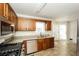 Modern kitchen featuring stainless steel appliances, granite countertops, and ample cabinet space at 380 Oak Landing Cir, Douglasville, GA 30134