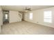 Bright living room with fresh paint and carpet, complemented by multiple windows and a staircase at 380 Oak Landing Cir, Douglasville, GA 30134