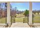 Serene backyard view from porch, showcasing lush lawn and mature trees at 4320 Chapel Hill Farms Dr, Douglasville, GA 30135
