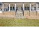 Front porch with stone steps, columns, and wrought iron railings at 4320 Chapel Hill Farms Dr, Douglasville, GA 30135