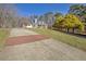 Spacious front yard with long driveway, lush landscaping, and mature trees at 4320 Chapel Hill Farms Dr, Douglasville, GA 30135