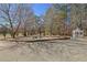 Landscaped front yard with gazebo and stone seating area at 4320 Chapel Hill Farms Dr, Douglasville, GA 30135