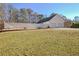 White garage with double doors and a fenced backyard at 4320 Chapel Hill Farms Dr, Douglasville, GA 30135