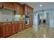 Eat-in kitchen boasts stainless steel appliances and wood cabinetry at 4320 Chapel Hill Farms Dr, Douglasville, GA 30135