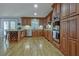 Spacious kitchen with wood cabinets, stainless steel appliances, and hardwood floors at 4320 Chapel Hill Farms Dr, Douglasville, GA 30135