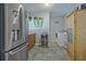 Laundry room includes washer, dryer, refrigerator, and cabinets at 4320 Chapel Hill Farms Dr, Douglasville, GA 30135
