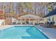 Relaxing pool area with pergola, patio furniture, and shed at 4320 Chapel Hill Farms Dr, Douglasville, GA 30135