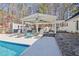 Inviting pool and patio area with pergola and plenty of seating at 4320 Chapel Hill Farms Dr, Douglasville, GA 30135