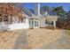 Side yard with gravel landscaping and a walkway to the entrance at 4320 Chapel Hill Farms Dr, Douglasville, GA 30135