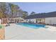 Large rectangular swimming pool with concrete decking at 4320 Chapel Hill Farms Dr, Douglasville, GA 30135