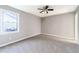 Bedroom with grey walls, ceiling fan, and carpet flooring at 2947 Pebblebrook Dr, Buford, GA 30518