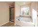 Relax in this spa-like bathroom, featuring a soaking tub and walk-in shower at 3686 Bills Cir, Atlanta, GA 30331