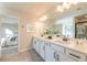 Double vanity bathroom with a large mirror and a walk-in shower at 3686 Bills Cir, Atlanta, GA 30331