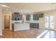 Modern kitchen with gray cabinets, island, and stainless steel appliances at 3686 Bills Cir, Atlanta, GA 30331