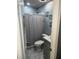 Bathroom with grey vanity, shower/tub combo, and marble-look flooring at 553 Wellington Way, Jonesboro, GA 30238