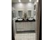 Double vanity bathroom with marble floors at 553 Wellington Way, Jonesboro, GA 30238