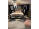 Main bedroom with tufted headboard and accent chairs at 553 Wellington Way, Jonesboro, GA 30238