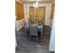 Formal dining room with a chandelier and grey wood-look flooring at 553 Wellington Way, Jonesboro, GA 30238