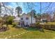 View of house back, yard, and fence at 553 Wellington Way, Jonesboro, GA 30238