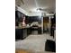 Galley kitchen with black cabinets, stainless steel appliances, and tile flooring at 553 Wellington Way, Jonesboro, GA 30238
