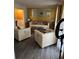 Spacious living room with light colored furniture and gold accent wall at 553 Wellington Way, Jonesboro, GA 30238