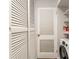 Laundry room with washer, dryer, and built-in shelving at 100 Alden Nw Ave # A3, Atlanta, GA 30309