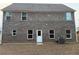 Exterior backyard with brick and windows at 132 Oliver Dr, Locust Grove, GA 30248