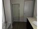 Bathroom features shower with glass door and vanity at 132 Oliver Dr, Locust Grove, GA 30248