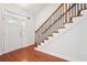 Elegant staircase with wrought iron railing and hardwood floors at 1645 Piedmont Ln, Cumming, GA 30040