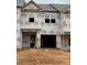 New construction townhome featuring a garage and covered entry, ready for customization at 2812 Lillian Ln, Douglasville, GA 30135