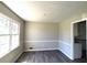 Spacious dining room with hardwood floors and neutral walls at 4153 Wellington Hills Dr, Snellville, GA 30039