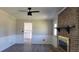 Living room with hardwood floors, fireplace and view into kitchen at 4153 Wellington Hills Dr, Snellville, GA 30039