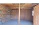 Empty storage shed with wood frame and shelving at 4153 Wellington Hills Dr, Snellville, GA 30039