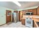 Kitchen boasts stainless steel appliances and wood cabinets at 6685 Smoke Ridge Dr, Atlanta, GA 30349